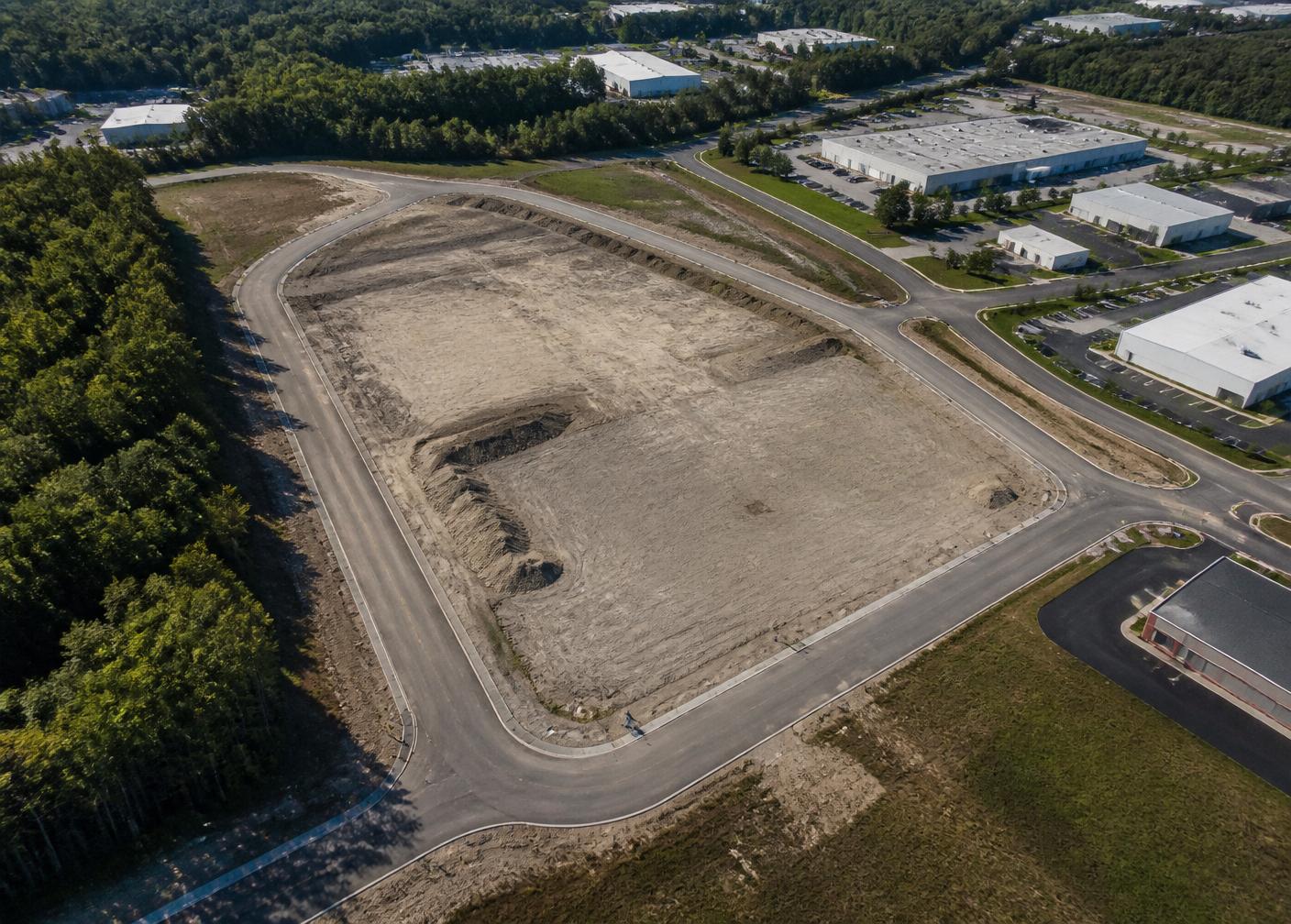 Aerial view of a cleared industrial parcel prepared for development